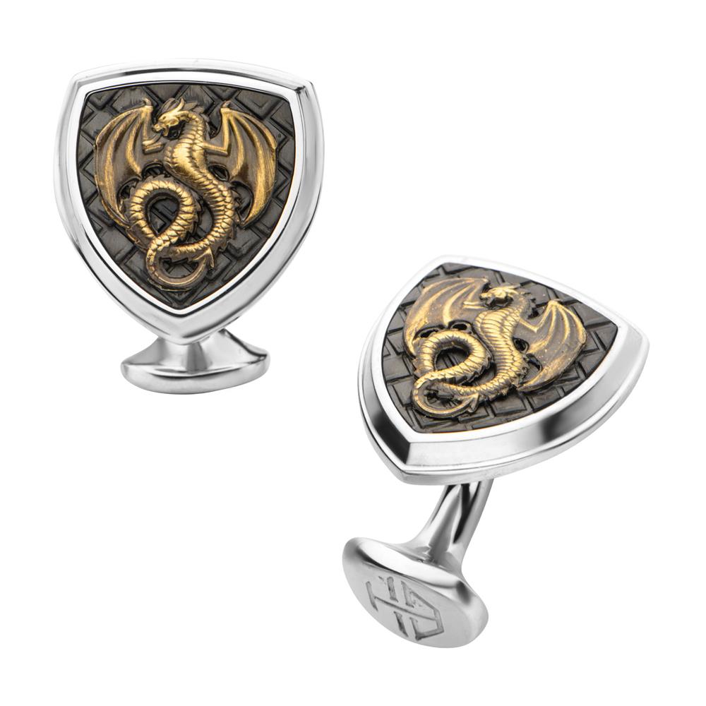 Introducing the Hollis Bahringer Men's Antique Cufflinks by INOX. These silver cufflinks, part of the Kingdom Collection, feature a refined shield-shaped design. Each piece showcases a detailed gold dragon set against a textured dark background with an intricate pattern. The dragon's central positioning gives these cufflinks an elegant and mythical appearance.