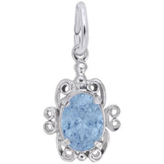 The Filigree March Birthstone Charm in sterling silver by Rembrandt Charms showcases an intricately detailed turtle-shaped design with swirling patterns and an aquamarine-colored stone as the shell. It features a silver loop at the top for easy attachment to a necklace or bracelet, exemplifying Rembrandt Charms' exquisite craftsmanship.