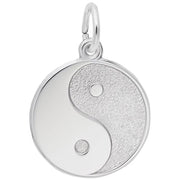 Rembrandt Charms' Yin Yang Charm in sterling silver showcases the iconic yin-yang design, with one half polished and the other textured, separated by a graceful curve. Each segment contains a small circle of the opposite color. The charm is finished with a convenient loop at the top for easy necklace attachment.