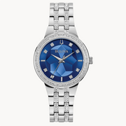 The Bulova Watch Company’s CRYSTAL L W BR BL C120 features a silver band with embedded crystals, a blue faceted dial with crystal markers and silver hands—offering polished elegance worthy of a chandelier.