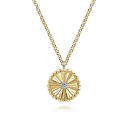 The Gabriel & Co 14K Gold Bujukan Diamond Pendant Necklace features a circular pendant with a textured, sunburst-like design and a central cluster of small diamonds. This pendant, part of the Bujukan Collection, is adorned with small gold beads along its edges and crafted from 14K white-yellow gold.