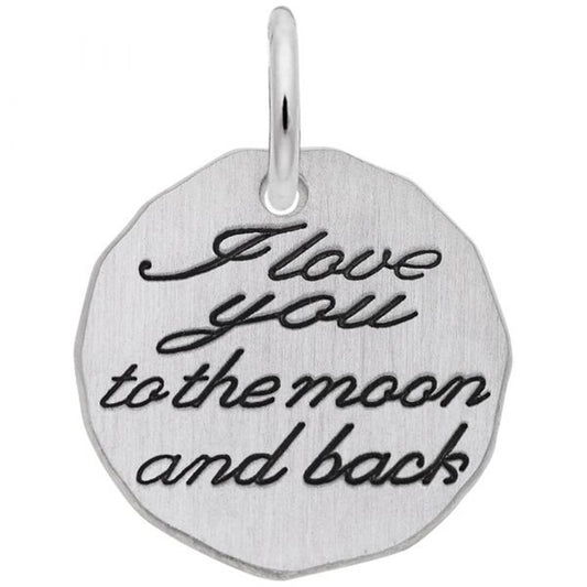 The I Love You To The Moon And Back Tag Charm by Rembrandt Charms is crafted from sterling silver, featuring a polished finish and cursive black lettering with the phrase "I love you to the moon and back." This circular charm has slightly irregular edges and includes a small loop at the top for attaching to a chain or bracelet.