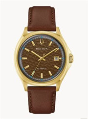 The Bulova Watch Company 97B244 NYC Tony Bennett men's watch features a gold-tone case, brown textured dial, gold hour markers, date at 3 o'clock, and a brown leather band—an elegant tribute to Tony Bennett.
