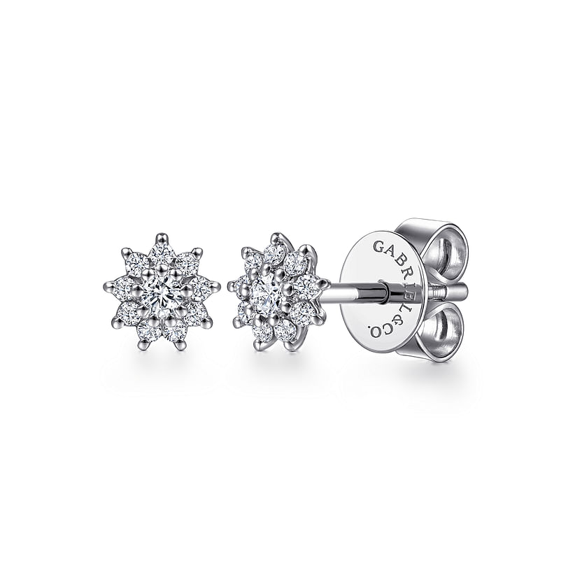 The Gabriel & Co 14K White Gold Cluster Diamond Flower Stud Earrings feature a floral design and butterfly backings, with "GABRIEL & CO." engraved on the back.