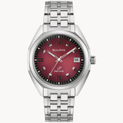 The Bulova Watch Company presents the Bulova Jet Star Watch with Maroon Dial and Stainless Steel Bracelet, featuring silver hour markers, black and red hands, and a date window at 3 o’clock for timeless style.