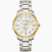 The luxurious Marine Star Ladies' Watch from Bulova Watch Company showcases a silver and gold-tone stainless steel bracelet. Its round face is adorned with diamond accents, gold hands, and a mother-of-pearl dial. This exquisite timepiece is water-resistant up to 100 meters.