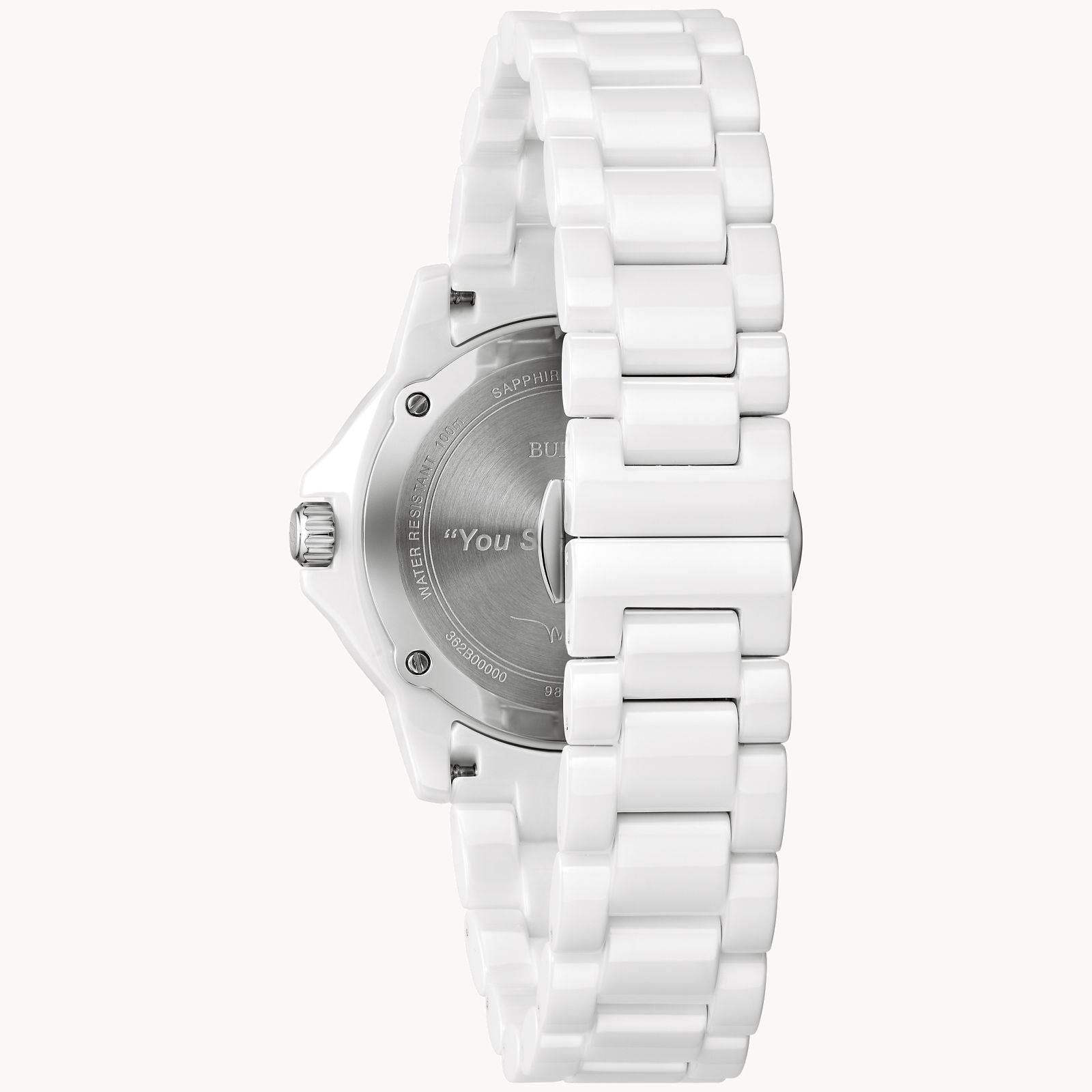 A Bulova Marc Anthony Marine Star White Dial Women's Watch by Bulova Watch Company is shown from the back, displaying a silver engraved case back, left-side crown, and a white ceramic link-style bracelet.
