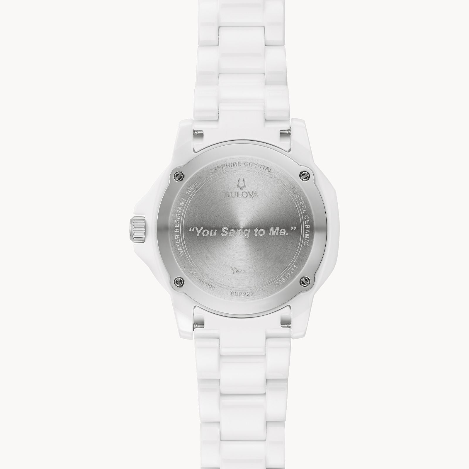 The back of a Bulova Marc Anthony Marine Star White Dial Women's Watch from Bulova Watch Company is engraved with “You Sang to Me,” along with branding details and specifications on the edge of the case back.