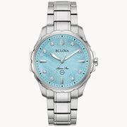 The Bulova Watch Company Marine Star Ladies' Watch features a light blue mother of pearl dial, diamond accents, silver hour markers, a stainless steel band, and 100m water resistance.