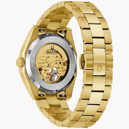 The Bulova Watch Company Surveyor M Y BR CH AUTO is an elegant men's automatic watch, featuring a gold stainless steel bracelet, engraved details, and a see-through back that reveals the inner mechanical movement.
