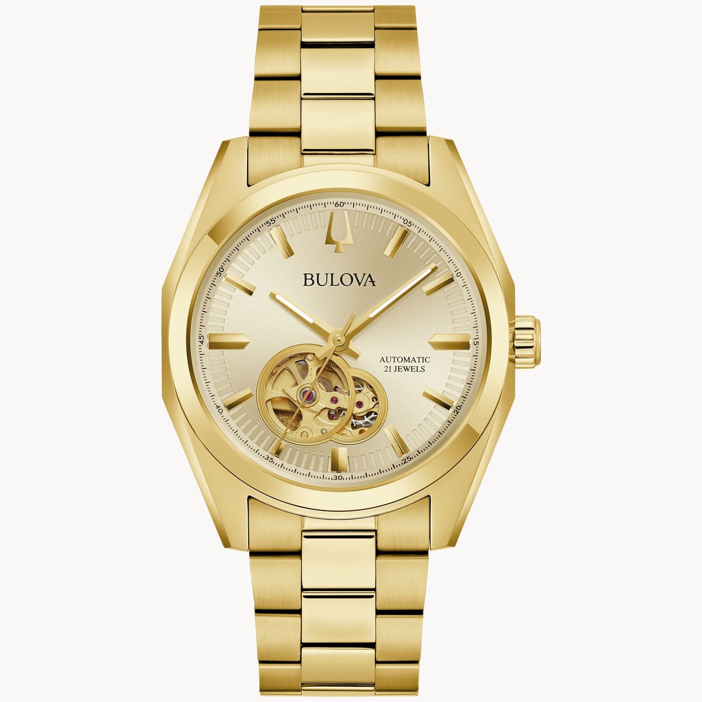 The Bulova Watch Company Surveyor M Y BR CH AUTO is a men’s gold watch with a metallic link band, open-heart dial showing inner gears, gold hour markers on a light gold face, and “Automatic 21 Jewels” text.