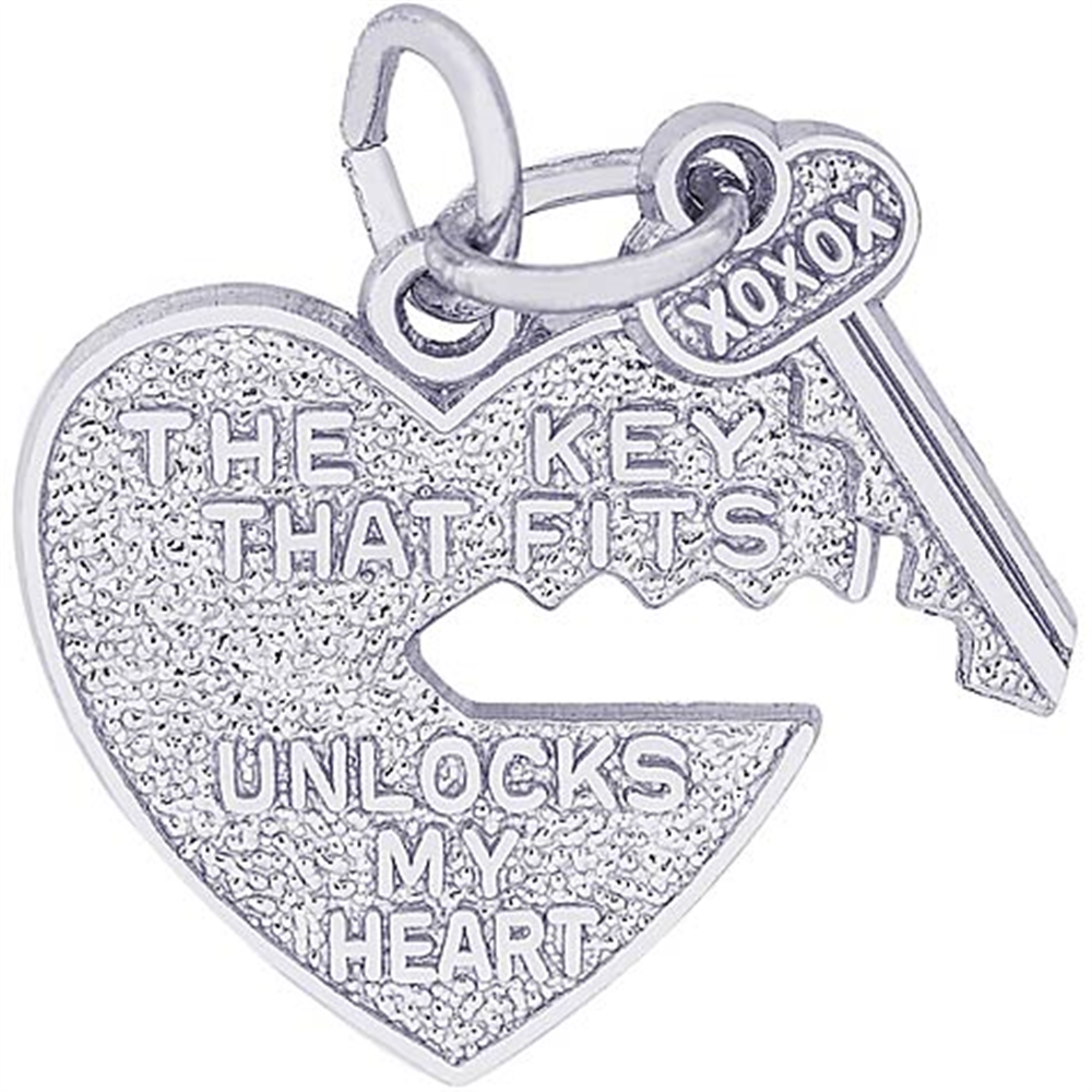 The Rembrandt Charms Heart and Key sterling silver charm features a jagged heart with "THE KEY THAT FITS UNLOCKS MY HEART" and an engraved key saying "XOXOX," symbolizing love and connection.