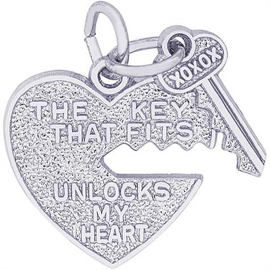 The Rembrandt Charms Heart and Key sterling silver charm features a jagged heart with "THE KEY THAT FITS UNLOCKS MY HEART" and an engraved key saying "XOXOX," symbolizing love and connection.