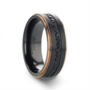 The ASTRO Flat Brushed Black Titanium Ring with Rose Gold Plated Edge by Thorsten boasts a matte finish with black sapphire settings in the center. It features two thin, rose gold plated edges that provide a striking contrast. The sleek and modern design is completed by a smooth, black interior.