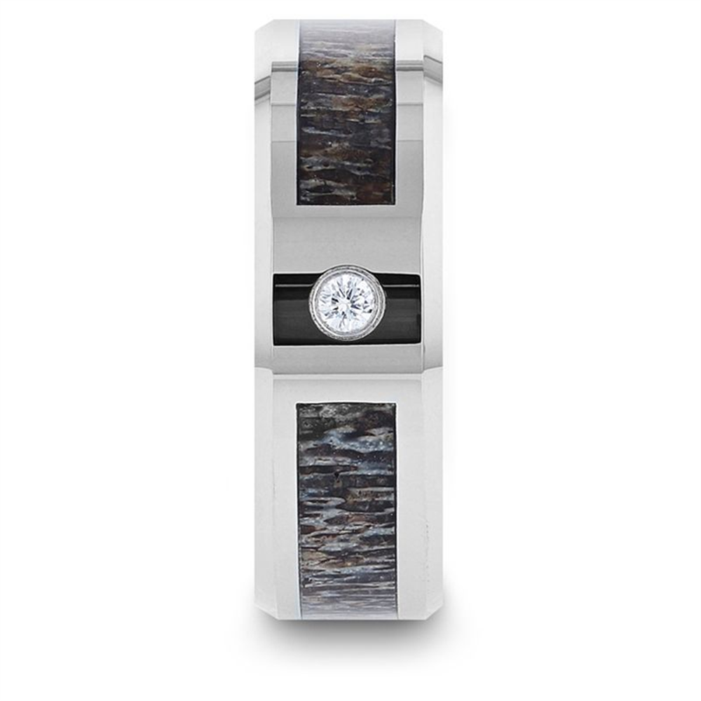 The Thorsten COLTON ring boasts a sleek silver finish with a dark textured deer antler inlay and a central diamond set into its black band. The inlay's wood grain pattern adds a rustic yet elegant touch to the modern tungsten carbide design, complemented by polished beveled edges. The ring is 8mm wide, embodying both sophistication and rugged charm.