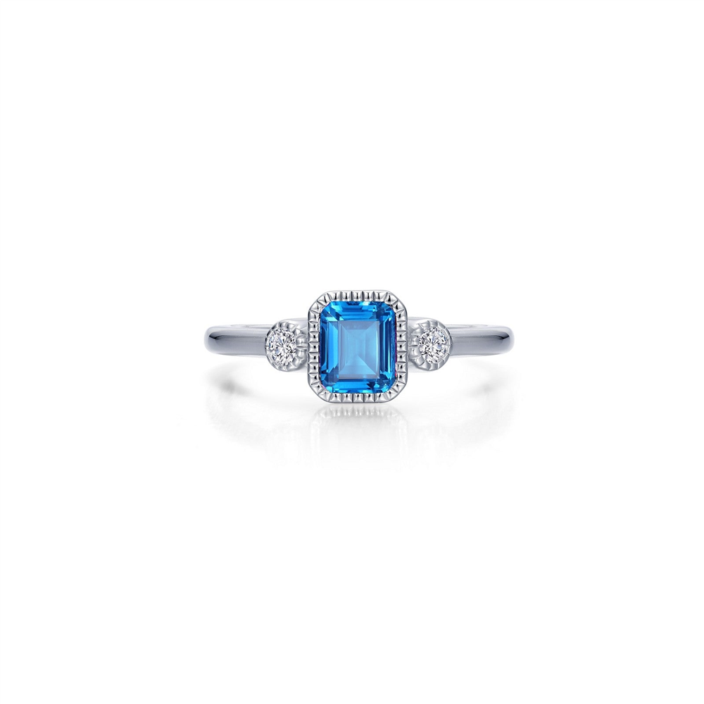 Introducing the Lafonn SIMULATED BLUE TOPAZ; DECEMBER B-STONE RING 07: a stunning silver ring that showcases a central rectangular-cut simulated blue topaz, the December birthstone. This exquisite stone is flanked by two small round diamonds on either side and set in a square halo adorned with additional small diamonds, adding an elegant touch to this beautiful piece.