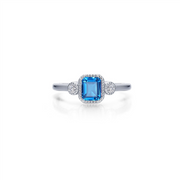 Introducing the Lafonn SIMULATED BLUE TOPAZ; DECEMBER B-STONE RING 07: a stunning silver ring that showcases a central rectangular-cut simulated blue topaz, the December birthstone. This exquisite stone is flanked by two small round diamonds on either side and set in a square halo adorned with additional small diamonds, adding an elegant touch to this beautiful piece.