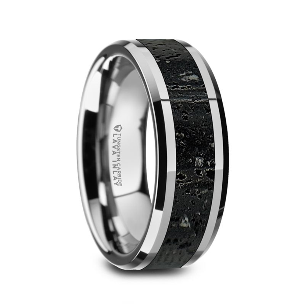 The KILAUEA Men’s Polished Tungsten Wedding Band by Thorsten showcases a sleek, modern design with a shiny silver exterior featuring a dark, textured black and gray lava rock stone inlay. The rough stone finish is elegantly bordered by slim silver bands, while the inner side of the band is smooth, reflective, and engraved with text.