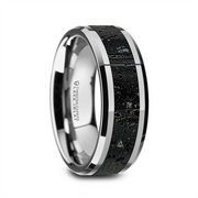 The KILAUEA Men’s Polished Tungsten Wedding Band by Thorsten showcases a sleek, modern design with a shiny silver exterior featuring a dark, textured black and gray lava rock stone inlay. The rough stone finish is elegantly bordered by slim silver bands, while the inner side of the band is smooth, reflective, and engraved with text.