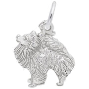 A detailed image of the Sterling Silver Pomeranian Dog Charm by Rembrandt Charms. This charm features an intricately detailed Pomeranian dog, measuring 0.48 inches by 0.48 inches (12.17 mm by 12.19 mm). The charm has a polished sterling silver finish, perfect for adding a touch of canine charm to any bracelet or necklace. Style number 1758.