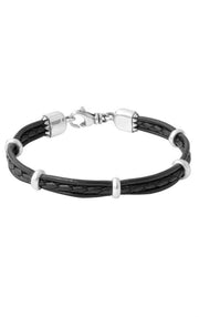 The Multi Strand Leather & Silver Bracelet by King Baby combines black braided leather with stylish silver beads and lobster claw clasps. It features a central silver loop and alternating small silver rings along the braided leather, all handcrafted in the USA.