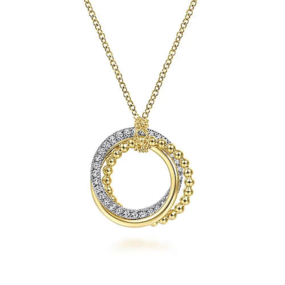 Discover the Gabriel & Co. 14K Yellow Gold Bujukan Diamond Interlocking Circles Pendant Necklace, featuring two interconnected circular pendants. One circle is adorned with sparkling silver accents, while the other boasts a beaded design. The pendant hangs from a delicate gold chain.