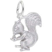 The Squirrel Charm in sterling silver from the Rembrandt Charms collection showcases a meticulously designed squirrel sitting while clutching a nut in its front paws. The charm features detailed fur texture, a prominent bushy tail, and includes a small loop at the top for easy attachment.