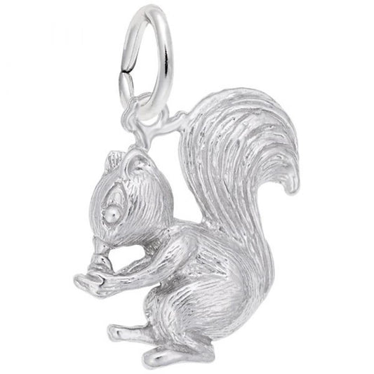 The Squirrel Charm in sterling silver from the Rembrandt Charms collection showcases a meticulously designed squirrel sitting while clutching a nut in its front paws. The charm features detailed fur texture, a prominent bushy tail, and includes a small loop at the top for easy attachment.