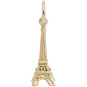 A small, 14K yellow gold Eiffel Tower charm from Rembrandt Charms, featuring a circular loop at the top to attach to a bracelet or necklace. The product description highlights detailed engravings that replicate the structure of the iconic Paris landmark.