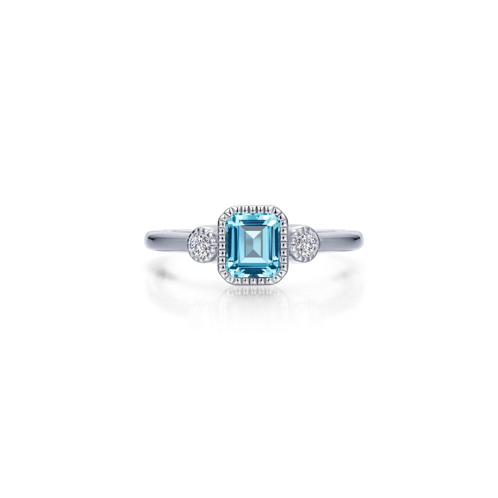 Introducing the Lafonn March Birthstone Ring, an elegant piece featuring a radiant blue gemstone in an emerald cut, set in a sleek silver band. This sophisticated design is enhanced by a pair of small round diamonds on each side of the central blue stone, adding extra sparkle to its allure.