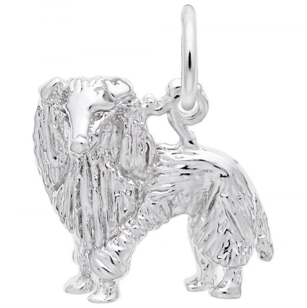 The Rembrandt Charms Sheltie Dog Charm in sterling silver boasts an intricate design that mimics the detailed fur patterns of a Sheltie or Collie, complete with a small loop at the top for easy attachment to jewelry.