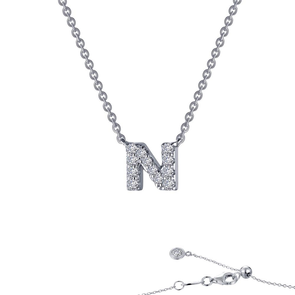 The Letter N Pendant Necklace by Lafonn is a stunning silver statement piece featuring a pendant adorned with small, sparkling crystals. Its fine chain includes a clasp for secure fastening, offering an elegant and minimalistic design. This timeless piece of jewelry radiates sophistication and charm.