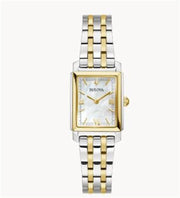 The Bulova Watch Company 98L308 Ladies Watch features a two-tone rectangular mother-of-pearl face, gold Roman numerals, and a gold and silver linked bracelet.