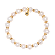 The Gold Empowered Elegance Collection- Pearl Gemstone Bracelet by T Jazelle features round white pearls with gold rings and a gold charm inscribed with "Empower.