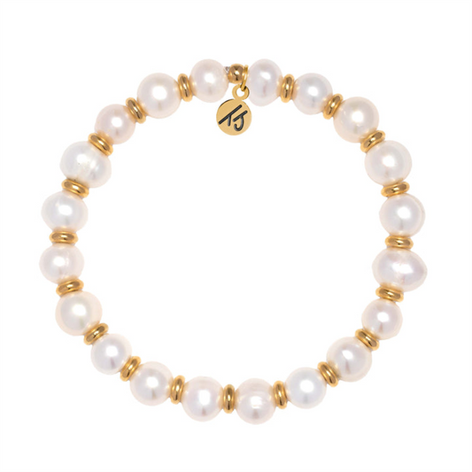 The Gold Empowered Elegance Collection- Pearl Gemstone Bracelet by T Jazelle features round white pearls with gold rings and a gold charm inscribed with "Empower.