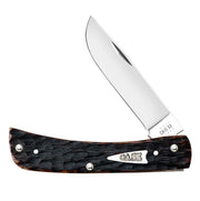 A folding knife with a partially opened stainless steel blade. The handle, crafted from Brown Bone Peach Seed Jig, has a dark wood-like finish and features metal accents and screws. The brand name "CASE" is prominently displayed in metal on the handle, indicating it's made by W.R. Case & Sons Cutlery Co.