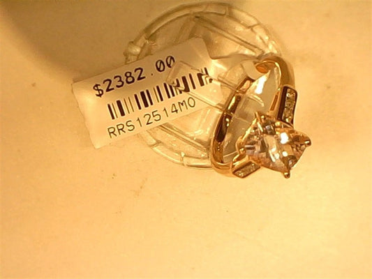 The Ryan Gems Cushion Cut Morganite Ring, crafted in 14k rose gold and size 7, features a dazzling gemstone with accent stones, displayed elegantly on a stand with a $2382.00 price tag against a light background.