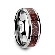 A polished JURASSIC Red Dinosaur Bone Inlaid Tungsten Carbide Beveled Edged Ring by Thorsten, featuring a glossy, reflective surface and a striking red and silver cracked pattern inlay. This beveled edged ring is engraved with "Tungsten Carbide" on the inner band.