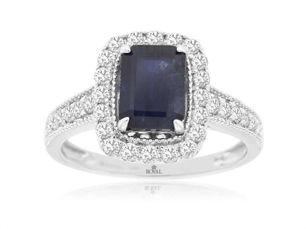 Introducing the Royal Jewelry's 14k WG Sapphire and Diamond ring, size 7: a sumptuous piece that features an emerald-cut sapphire at its center, encircled by a shimmering halo of round diamonds, all elegantly set on a 14k white gold band embellished with additional diamonds.