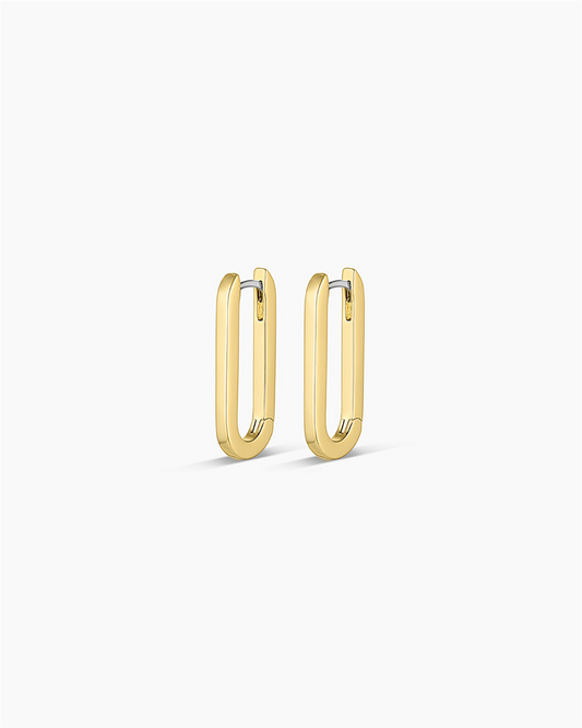 The Gorjana Parker Huggies are 18k gold plated earrings featuring a paper clip link design, displayed against a plain white background.