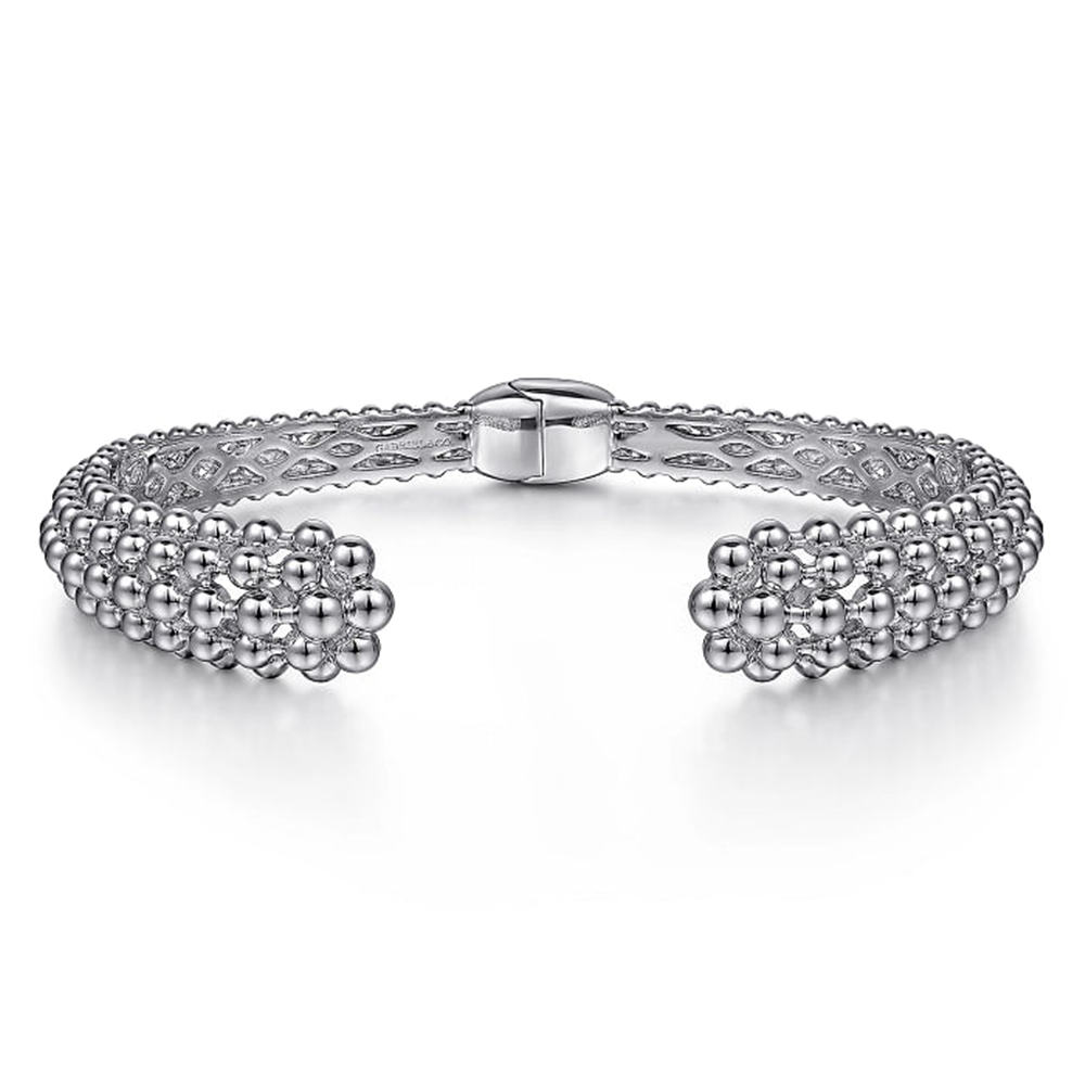 The 925 Sterling Silver Bujukan Hinged Cuff from Gabriel & Co's Boutique Bujukan Collection features intricate bead and lattice designs with a central clasp. The symmetrical pattern showcases a double row of small beads that meet at flower-like clusters near the clasp, highlighting exquisite craftsmanship.