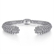 The 925 Sterling Silver Bujukan Hinged Cuff from Gabriel & Co's Boutique Bujukan Collection features intricate bead and lattice designs with a central clasp. The symmetrical pattern showcases a double row of small beads that meet at flower-like clusters near the clasp, highlighting exquisite craftsmanship.