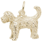 The Rembrandt Charms Labradoodle Dog Charm in gold-plated sterling silver features an intricately detailed fur texture and a convenient loop at the top for attaching to a chain. This small charm showcases the dog standing with its tail curved upwards, making it a perfect addition to your jewelry collection.