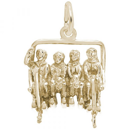 The Quadchair Ski Lift 10K Gold Charm by Rembrandt Charms features five seated figures in a detailed quadchair ski lift, each dressed in ski gear. The intricately crafted charm highlights both the lift and the unique features of the skiers, making it an ideal piece for any skiing enthusiast.