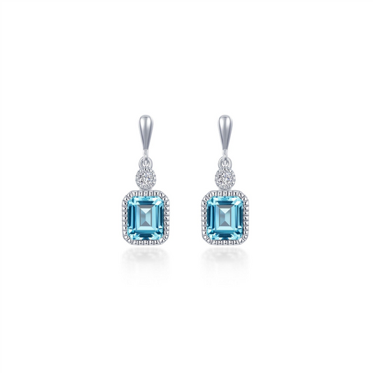 The Lafonn MARCH sim diamond, aquamarine earrings feature rectangular blue gemstones framed by sparkling sim diamonds and a round clear stone above each, all set in elegant silver.