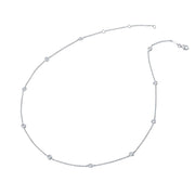 The Lafonn Classic Station Necklace is a delicate silver piece featuring evenly spaced small round diamond accents along its chain. This timeless necklace is arranged in a circular shape with a lobster clasp closure visible at one end, set against a plain white background.