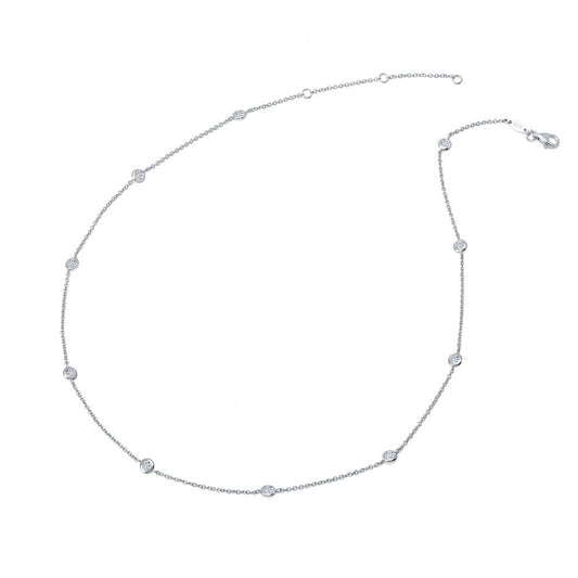 The Lafonn Classic Station Necklace is a delicate silver piece featuring evenly spaced small round diamond accents along its chain. This timeless necklace is arranged in a circular shape with a lobster clasp closure visible at one end, set against a plain white background.
