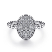 A stunning 925 Sterling Silver Oval Signet Ring with White Sapphire Pavé from the luxurious Bujukan Collection by Gabriel & Co showcases an oval-shaped setting encrusted with numerous small, sparkling white sapphires, featuring an elegant and timeless design.