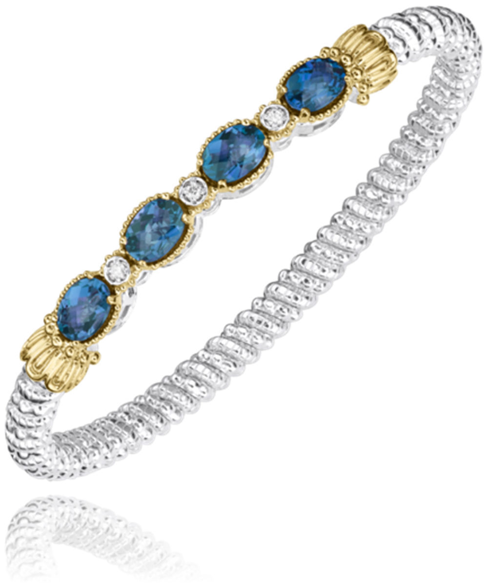 The Alwand Vahan Jewelry 4mm LBT closed band bracelet features four 7x5mm oval blue gemstones and three round diamonds set in textured sterling silver, accented with 14k gold around the stones.
