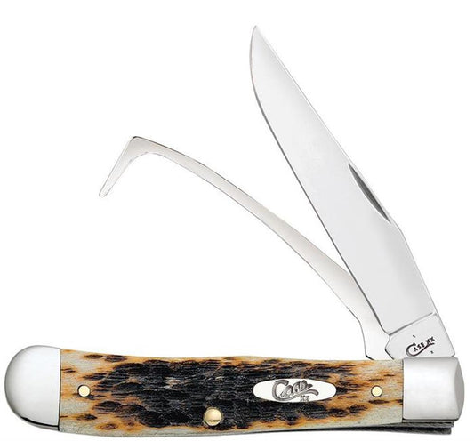 An equestrian's knife, the Amber Bone Peach Seed Jig Equestrian Knife (Case 00144) by W.R. Case & Sons Cutlery Co., features a distinctive stag-patterned Amber Bone handle. It comes with two blades: one standard and one hook-like, both in the open position. The handle is embellished with a silver bolster and a centered logo, ensuring it is as stylish as it is functional.